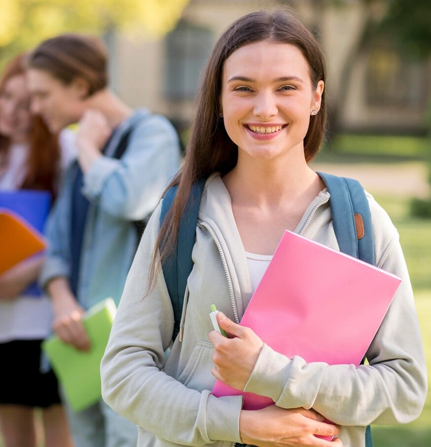 Smiling student holding books, supported by top Abroad Study Consultancy Kerala for her education